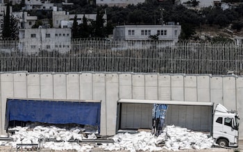 A vandalised and abando<em></em>ned humanitarian aid truck at the separation wall