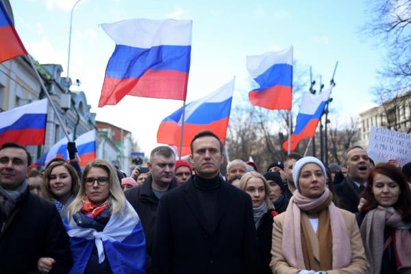 Russian opposition leader Alexei Navalny, his wife Yulia Navalnaya, opposition politician Lyubov Sobol and other demo<em></em>nstrators march in memory of murdered Kremlin critic Boris Nemtsov in downtown Moscow.