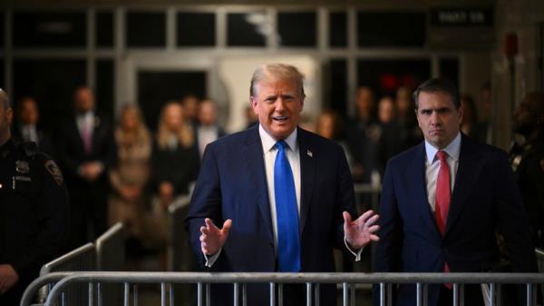 Do<em></em>nald Trump with his lawyer Todd Blanche, right, outside court. Pic: AP