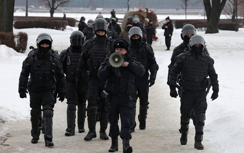 Officers arrive to disperse and arrest people gathering to ho<em></em>nour the memory of  Navalny