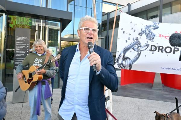 a man speaks into a microphone