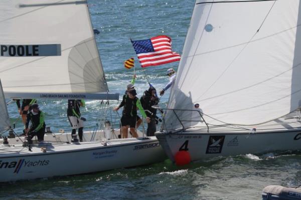 Team Poole’s boat, left, bumps Team Williams’ resulting in a...