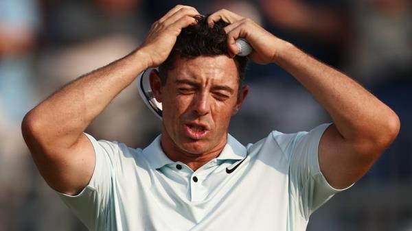 Rory McIlroy reacts after the 18th hole wher<em></em>e he made bogey