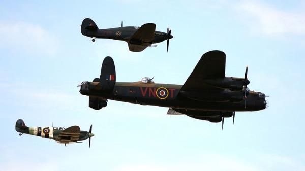 A Spitfire, a Hawker Hurricane, and a Lancaster bomber, part of the Battle of Britain Memorial Flight, during the annual Southport Air Show at Southport beach in Merseyside. Picture date: Saturday September 9, 2023.