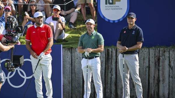 Scottie Scheffler, Rory McIlroy and Ludvig ?berg on the first tee