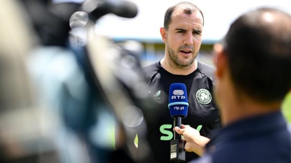 John O'Shea speaking to the press in Portugal