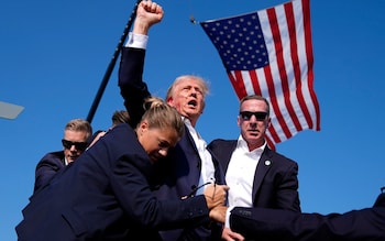 Do<em></em>nald Trump in the immediate aftermath of an attempt on his life at a campaign rally in Butler, Pennsylvania on July 13