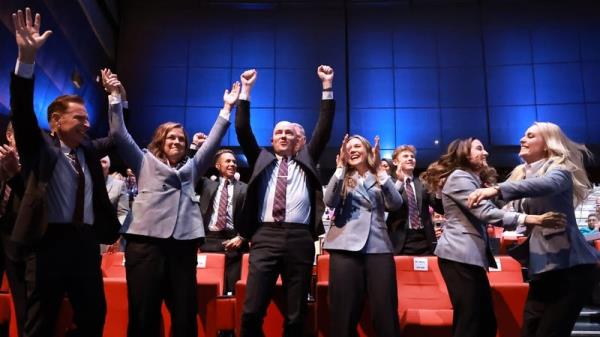 The Salt Lake City delegation celebrate as they're awarded the 2034 Games