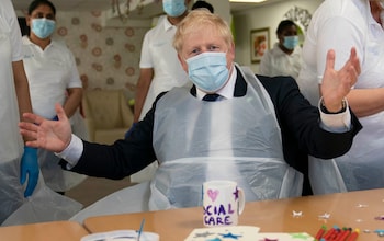 The former prime minister Boris Johnson during a visit to Westport Care Home, ahead of unveiling his plan to fix the 'crisis in social care'