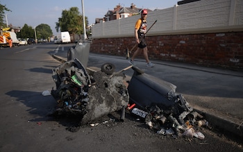 Damaged dustbins in Southport after riots