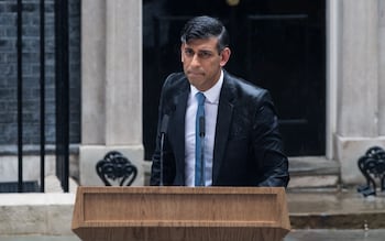 A rain-soaked Rishi Sunak makes the announcement outside No 10