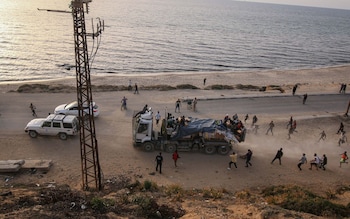 Eleven lorries full of aid were looted by desperate Palestinians who face starvation in Gaza