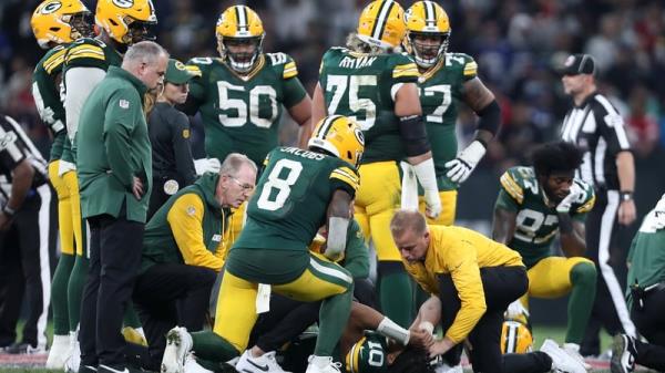 Packers' quarterback Jordan Love was forced off after sustaining a leg injury late on