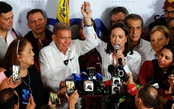 Venezuelan presidential candidate Edmundo Go<em></em>nzalez (C-L) and opposition leader Maria Corina Machado (C-R) make a statement to the media