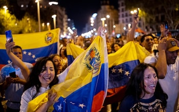 Venezuelan natio<em></em>nals residing in Spain hold their natio<em></em>nal flag during a demo<em></em>nstration to demand political change in their country 