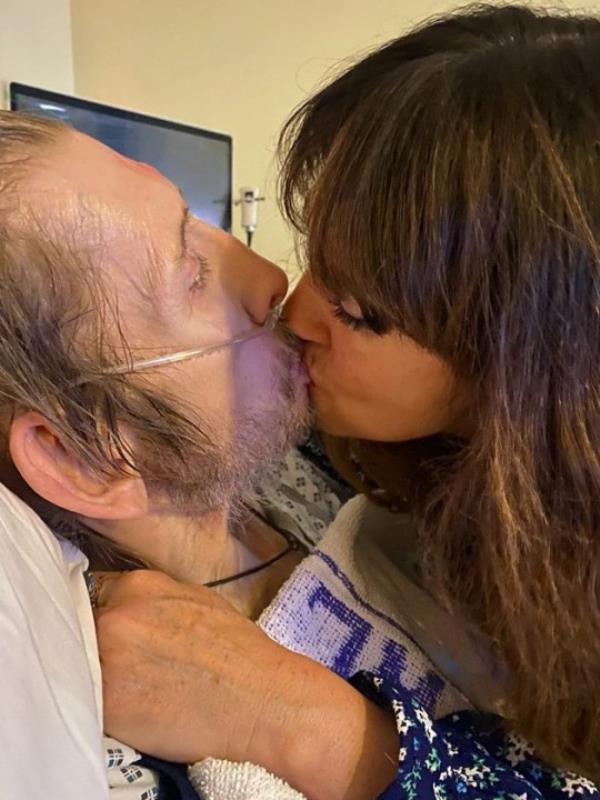 She shared a photo kissing her husband in his hospital bed with the devastating update (Picture: X / Instagram / Victoria Clarke)