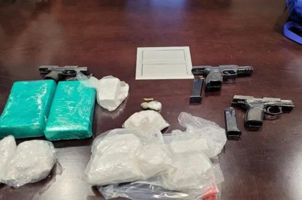 Police searched Hill's vehicle and allegedly found 1.5 kilograms of cocaine, a handgun and a small amount of marijuana.