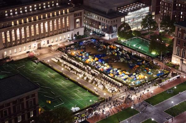 Members of the New York Police Department surround a pro-Palestinian encampment on the lawn of Columbia University as they stormed the campus to clear out anti-Israel protestors on Tuesday, April 30, 2024 in New York, N.Y