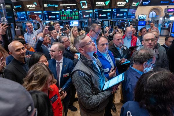 Traders on the New York Stock Exchange floor preparing for Reddit's initial public offering on March 21, 2024.