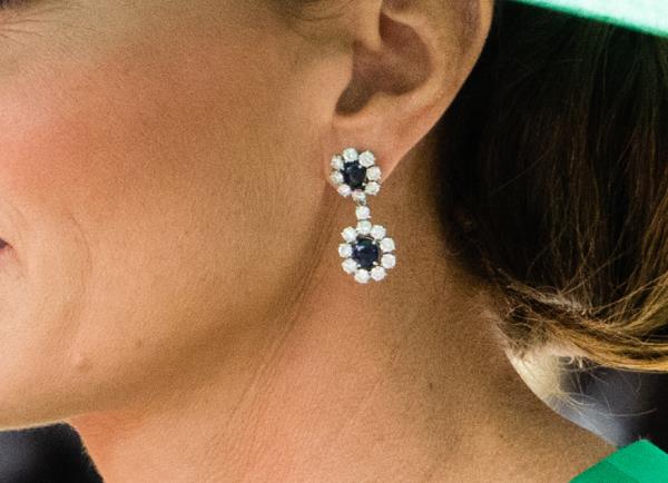 Middleton paired the earrings with a green dress and matching hat. 