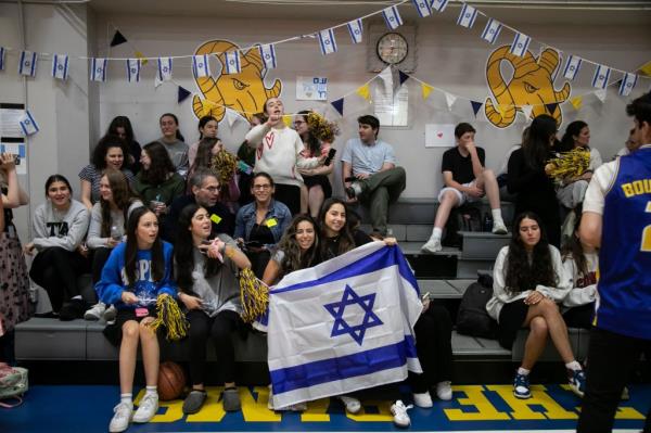 Students hold up an Israeli flag