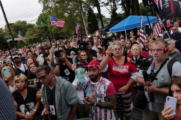 Staten Island residents gather to protest outside of a closed Catholic school-turned-migrant shelter on Staten Island.