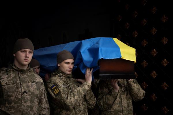 Ukrainian servicemen carry the coffin of a fellow soldier during a funeral last week. 