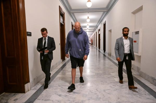 Senate Majority Leader Chuck Schumer relaxed the Senate's formal dress code so that Fetterman can vote in a sweatshirt and shorts.