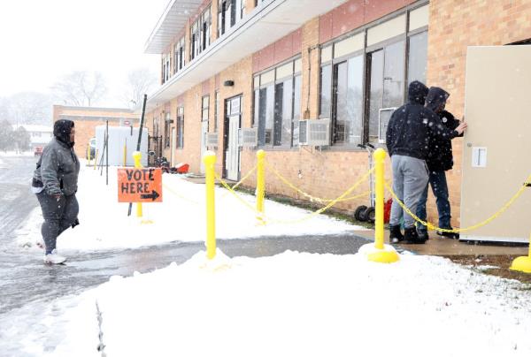 Voters arrive at the McKenna Elementary School on election day