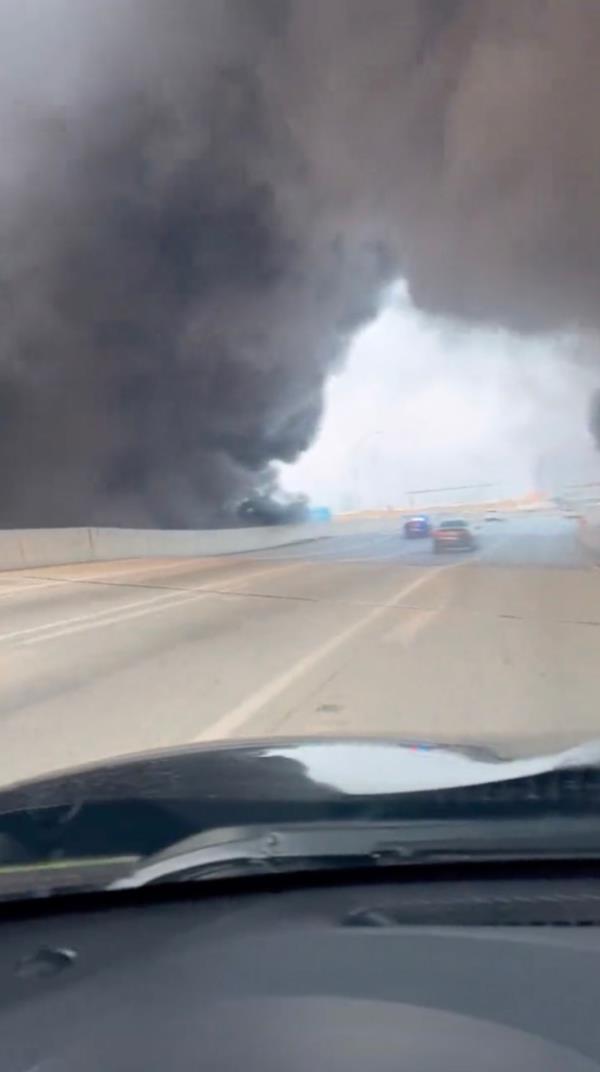 His car passed through the archway of smoke. 