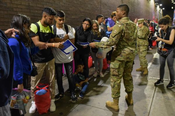 Migrants arriving at the Port Authority bus terminal in Manhattan on August 17, 2023.