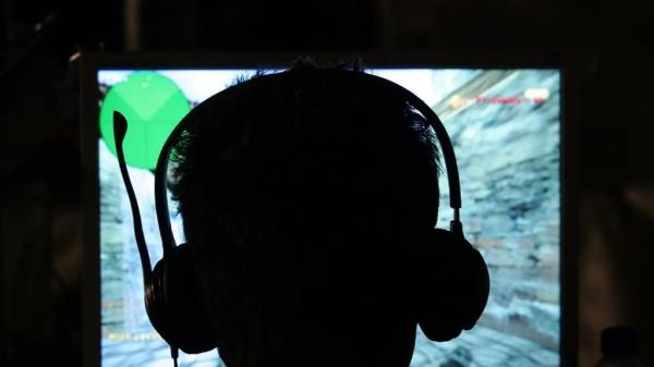 Air force member wearing a video game headset.