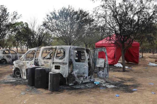 A burnt car on the festival grounds. 