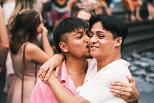 Two men kiss at the NYC Pride March.