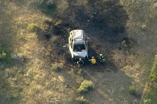 The burned out car in the patch of burned grass.