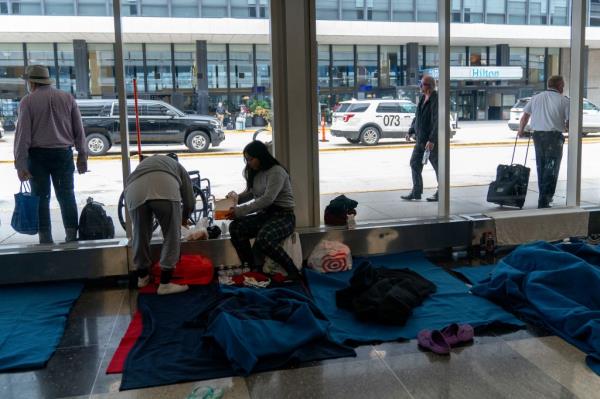 Migrants living at a makeshift shelter in Chicago's O'Hare Airport on September 20, 2023.