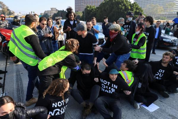 Protesters grabbing a driver. 