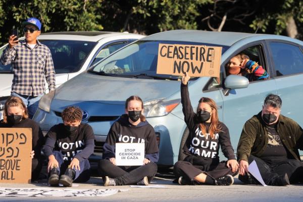 The group of protesters sitting on the highway. 