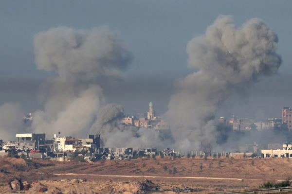 Smoke rises after an explosion on the northern part of the Gaza Strip, as seen from Sderot, southern Israel, 03 December 2023.