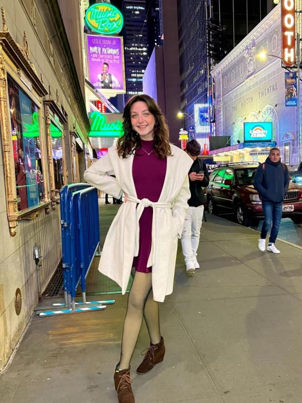 Cathleen Turner posing for photo on street of New York City