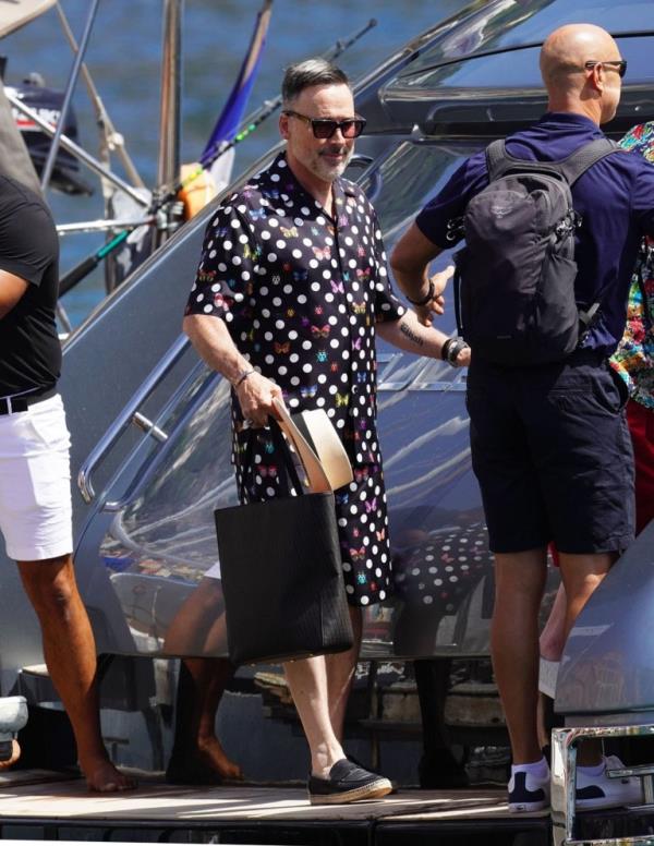 BGUK_2702497 - South of France, FRANCE - *EXCLUSIVE* - The Legendary British Singer Elton John wears his striking floral shirt out in the French sunshine with his husband David Furnish seen going o<em></em>nboard their yacht and heading to St Tropez. Pictured: Elton John BACKGRID UK 10 AUGUST 2023 UK: +44 208 344 2007 / uksales@backgrid.com USA: +1 310 798 9111 / usasales@backgrid.com *Pictures Co<em></em>ntaining Children Please Pixelate Face Prior To Publication*