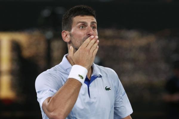 Novak Djokovic blows a kiss to the crowd after his win over Adrian Mannarino in the fourth round of the Australian Open.