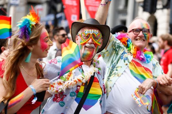 Rainbow-clad Pride revelers at a parade