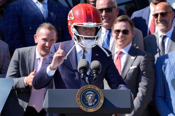 President Biden wore a Kansas City Chiefs helmet Friday on the White House lawn.