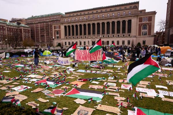 The campus lawn was littered with signs and flags as the center banner read, 