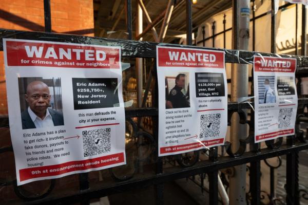 Anti-police flyers are put up on the corner of 1st Ave. and 9th Street