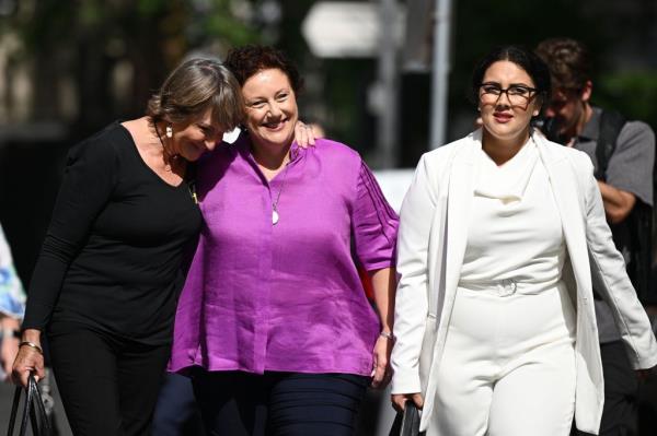 Kathleen Folbigg, center, walks with her lawyer Rhanee Rego, right, to the New South Wales Court of Criminal Appeal in Sydney, on Dec. 14, 2023.