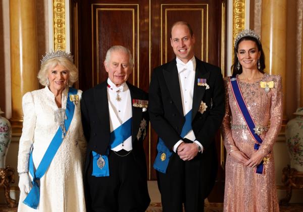 Britain's Queen Camilla, King Charles III, Prince William and Kate, Princess of Wales pose for a photograph ahead of the Diplomatic Reception in the 1844 Room at Buckingham Palace in London, England, Tuesday Dec. 5, 2023.