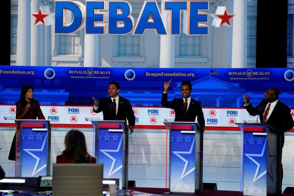 Former South Carolina governor Nikki Haley, left, and Sen. Tim Scott (R-SC), far right, argue during the second Republican presidential primary debate hosted by Fox News at Ro<em></em>nald Reagan Presidential Library in Simi Valley, Calif.