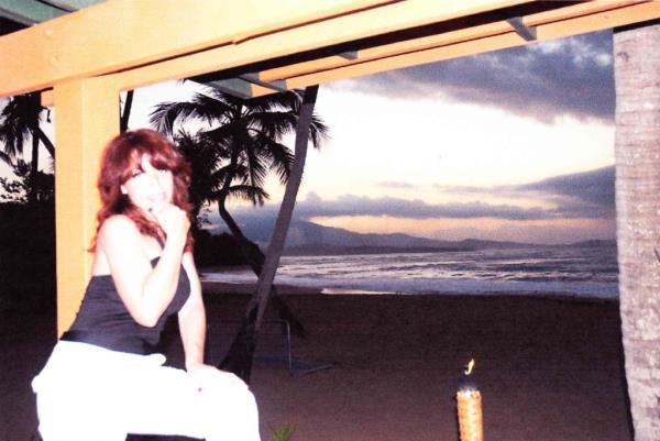 Cecilia Reynolds in front of a beach apparently at sunset